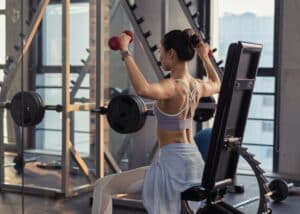 woman raising dumbbells